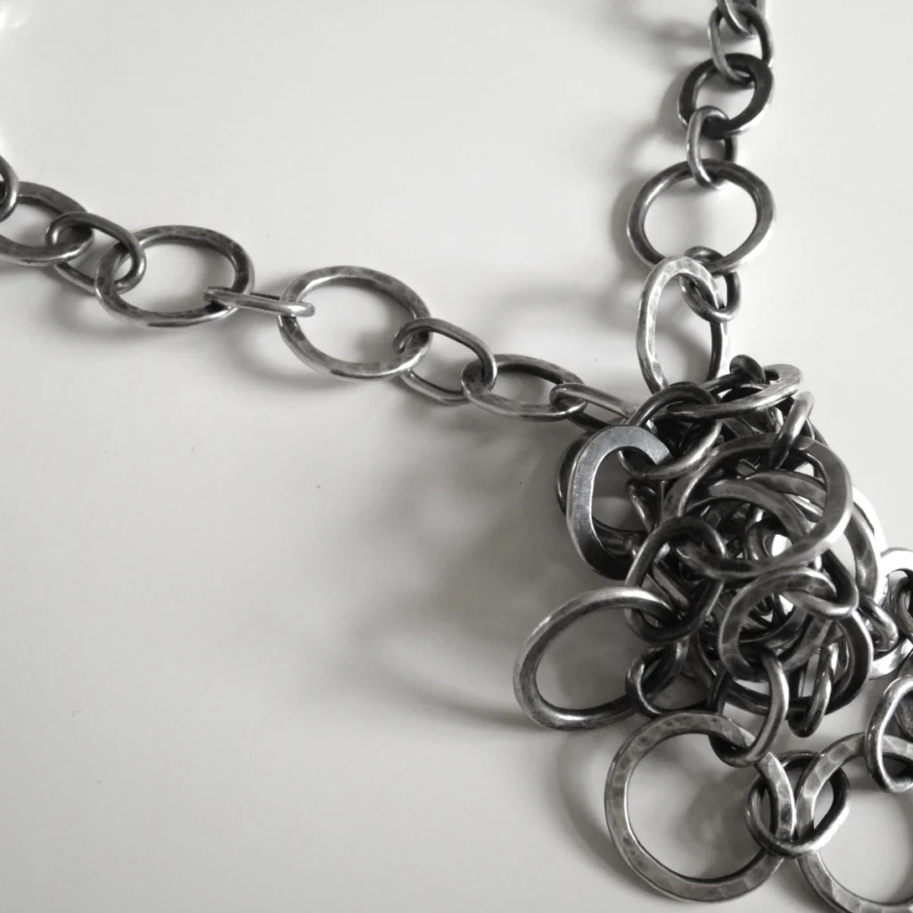 circles and ovals necklace in a knot closeup
